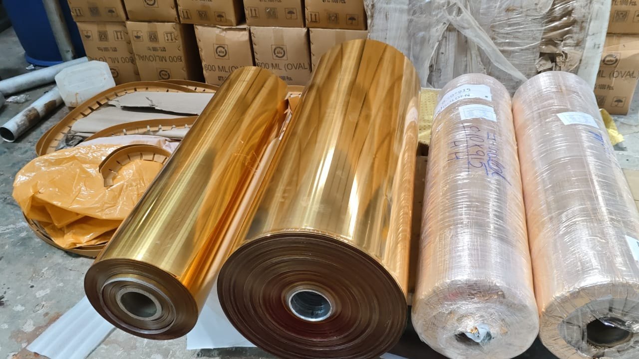 Metallic foil rolls used in foil pressed printing for enhanced colour durability and finish quality.